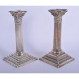 A PAIR OF 1930S SILVER CORINTHIAN COLUMN CANDLESTICK. Birmingham 1933. 48 oz. 22 cm high.