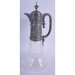 AN ANTIQUE CONTINENTAL SILVER MOUNTED GLASS CLARET JUG. 34 cm high.