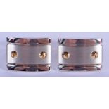 A PAIR OF CARTER STAINLESS STEEL TANK STYLE CUFFLINKS. 2.5 cm wide.