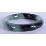AN EARLY 20TH CENTURY CHINESE CARVED ICEY JADEITE BANGLE Late Qing/Republic. 8 cm diameter.