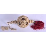 A 19TH CENTURY CHINESE CANTON HANGING IVORY PUZZLE BALL with figural terminal. 32 cm x 7 cm.