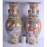 A LARGE PAIR OF 19TH CENTURY CHINESE CANTON ENAMEL FAMILLE ROSE VASES Qing, with lamp fittings. 58 c