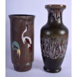 A 1960S GERMAN RETRO POTTERY VASE together with another retro vase. Largest 26 cm high. (2)
