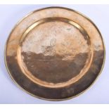 AN EARLY 20TH CENTURY CHINESE POLISHED BRASS DISH decorated with a figure and flowers. 30 cm diamete