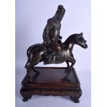 A 17TH/18TH CENTURY CHINESE BRONZE FIGURE OF A SCHOLAR ON HORSEBACK Late Ming/Qing, modelled upon a