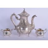 A GOOD ANTIQUE GERMAN THREE PIECE SILVER TEASET decorated with flowers. 43.1 oz. Teapot 22 cm x 15 c