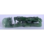 AN EARLY 20TH CENTURY CHINESE CARVED JADEITE BELT HOOK Late Qing/Republic. 6.75 cm long.