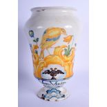 A 19TH CENTURY SOUTH EUROPEAN FAIENCE GLAZED DRUG JAR painted with a bird perched amongst foliage. 2