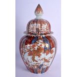 AN 18TH/19TH CENTURY JAPANESE EDO PERIOD IMARI FLUTED VASE AND COVER painted with birds. 32 cm high.