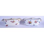 A RARE PAIR OF 18TH CENTURY SEVRES PORCELAIN BOTTLE COOLERS painted with floral sprays under a gilde