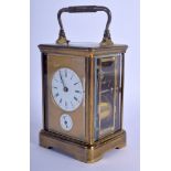 AN ANTIQUE FRENCH BRASS CARRIAGE CLOCK with white enamel dial. 19 cm high inc handle.