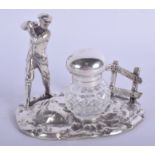 A 1920S ENGLISH SILVER PLATED GOLFING INKWELL. 13 cm x 13 cm.
