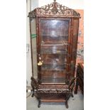 A 19TH CENTURY CHINESE CARVED HONGMU CABINET ON STAND of bamboo form. 195 cm x 92 cm.