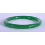 AN EARLY 20TH CENTURY CHINESE JADE SPINACH JADE BANGLE Late Qing/Republic. 7 cm wide.