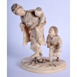 A 19TH CENTURY JAPANESE MEIJI PERIOD CARVED IVORY OKIMONO modelled as a mother with two children. 15