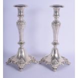 A PAIR OF ANTIQUE CONTINENTAL SILVER CANDLESTICKS overlaid with acanthus. 19 oz. 33 cm high.