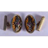 A PAIR OF CONTINENTAL SILVER AND ENAMEL JEWELLED CUFFLINKS. 2.75 cm wide.