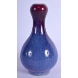 A CHINESE FLAMBE GLAZED PORCELAIN VASE probably Late Qing, bearing Kangxi marks to base. 14.5 cm hig