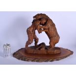 A RARE EARLY 20TH CENTURY BAVARIAN BLACK FOREST CARVED WOOD FIGURAL GROUP depicting a bear wrestling