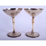 A PAIR ART DECO GERMAN SILVER AND IVORY TAZZA M T Wetzlar of Munich, probably designed by Fritz Schm