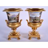 A PAIR OF 19TH CENTURY FRENCH PARIS PORCELAIN PEDESTAL VASES painted with landscapes. 22 cm high.