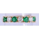 AN 18CT GOLD DIAMOND AND EMERALD RING. 3.4 grams. N.