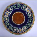 A 19TH CENTURY MINTON MAJOLICA CIRCULAR DISH decorated with figures and foliage. 24 cm diameter.