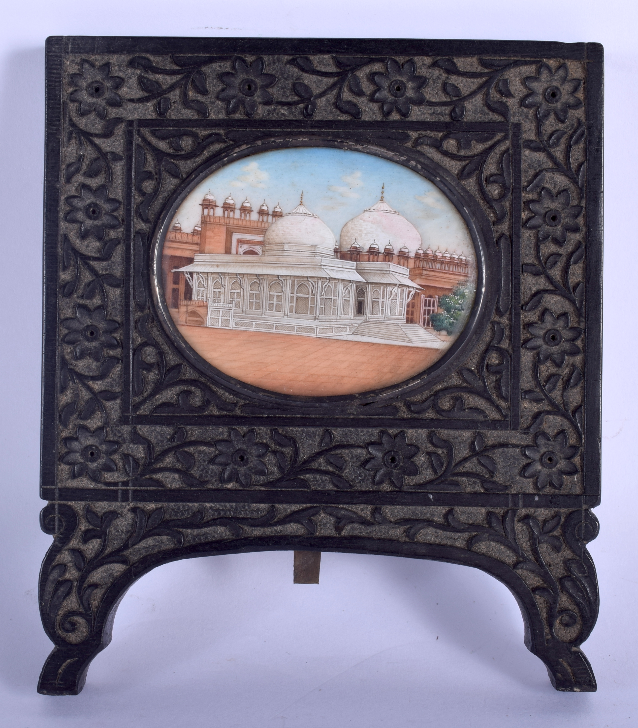 A 19TH CENTURY ANGLO INDIAN PAINTED IVORY PORTRAIT MINIATURE depicting a view of an Indian temple. I