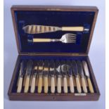 AN EARLY 20TH CENTURY IVORY SILVER AND SILVER PLATED CUTLERY SET. (qty)