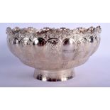 A MIDDLE EASTERN INDO PERSIAN SILVER EMBOSSED FRUIT BOWL with unusual openwork rim. 15 oz. 23 cm dia