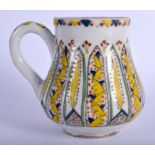 A TURKISH MIDDLE EASTERN FAIENCE POTTERY WINE CUP painted with flowers. 10.5 cm high.