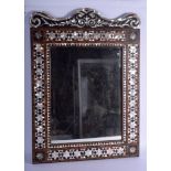 A 19TH CENTURY TURKISH MIDDLE EASTERN MOTHER OF PEARL INLAID MIRROR decorated with geometric motifs.