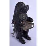 A 19TH CENTURY BAVARIAN BLACK FOREST SMOKERS COMPENDIUM modelled as a begging hound. 28 cm x 11 cm.