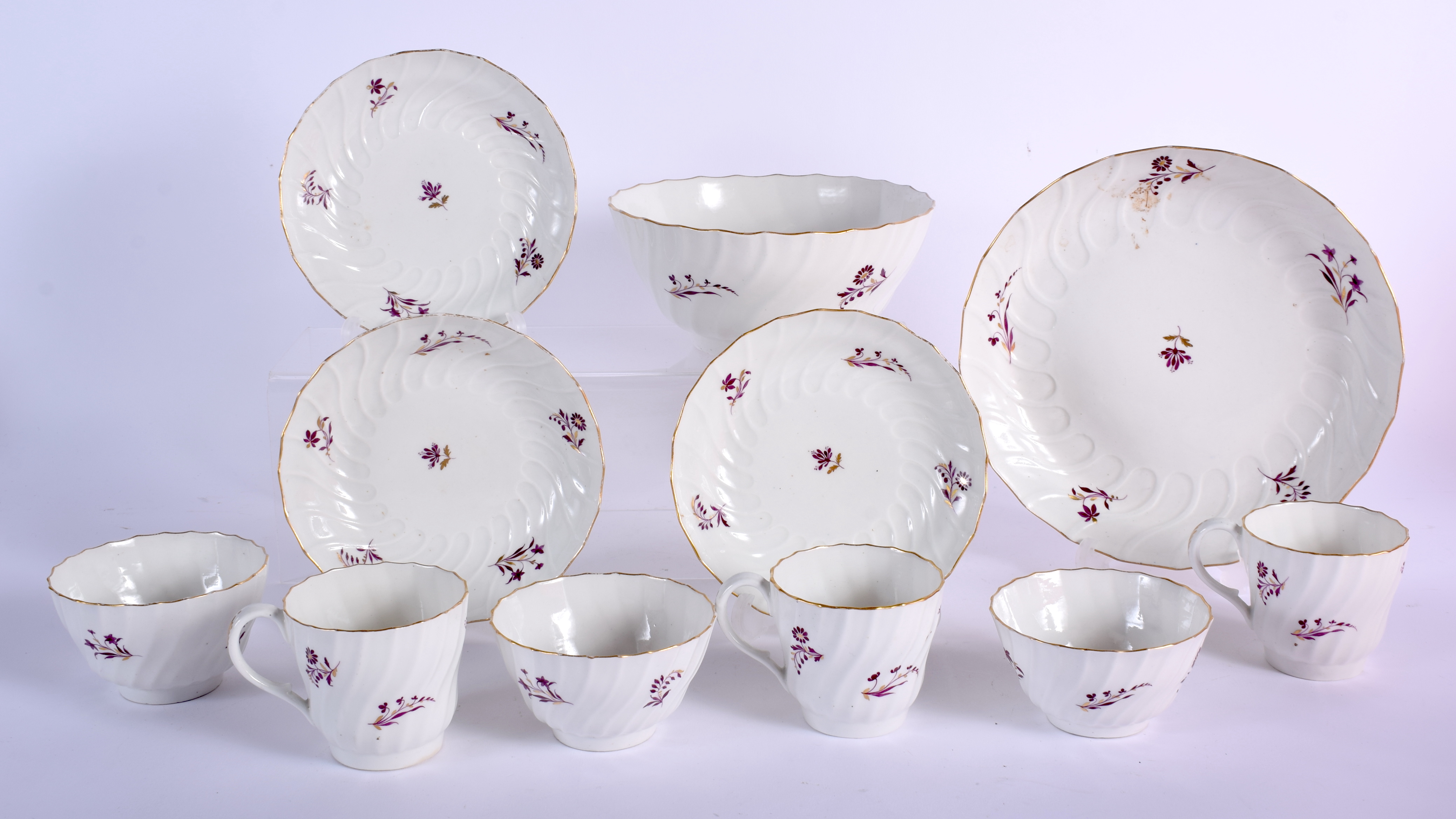 Three Flight coffee cups, saucers and teabowls and a match slop bowl with puce flowers. 19.5 cm wide