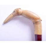 A 19TH CENTURY CONTINENTAL CARVED RHINOCEROS HORN HANDLED WALKING CANE. 88 cm long.