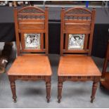 A PAIR OF 19TH CENTURY ARTS AND CRAFTS CHAIRS inset with Minton tiles. 101 cm x 47 cm.