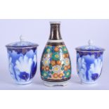 A PAIR OF EARLY 20TH CENTURY JAPANESE TAISHO PERIOD FUKAGAWA JARS AND COVERS together with a vase. L