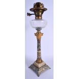 A 19TH CENTURY FRENCH CHAMPLEVE ENAMEL BRONZE CANDLESTICK OIL LAMP decorated with foliage. 47 cm hig