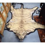 A VICTORIAN CARVED TAXIDERMY TIGER SKIN RUG Van ingen & Van ingen. 326 cm x 227 cm.