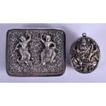 AN ANTIQUE SOUTH EAST ASIAN SILVER BUCKLE and a silver pendant. 80 grams. (2)