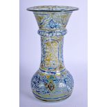 A RARE ANTIQUE MIDDLE EASTERN ISLAMIC ENAMELLED GLASS VASE decorated with kufic script. 19 cm high.