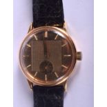 AN 18CT GOLD MOVADO GENTLEMAN WRISIWATCH with twin dial. 35.6 grams. 3.25 cm wide.