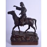 A 19TH CENTURY RUSSIAN BRONZE FIGURE OF A ROAMING COSSACK modelled upon a horse. 24 cm x 15 cm.
