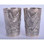 A PAIR OF CONTINENTAL SILVER BEAKERS decorated with foliage. 6.7 oz. 8.5 cm high.