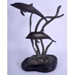 A BRONZE SCULPTURE OF SWIMMING DOLPHINS modelled upon a marble base. 30 cm x 15 cm.