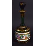 A 19TH CENTURY BOHEMIAN ENAMELLED GREEN GLASS SCENT BOTTLE painted with flowers. 16.5 cm high.