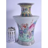 A 1950S CHINESE FAMILLE ROSE BALUSTER VASE decorated with figures within landscapes. 30 cm x 15 cm.