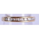 A GOLD AND DIAMOND ETERNITY RING. 1.7 grams. J.