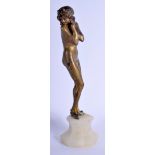 AN ART NOUVEAU COLD PAINTED BRONZE FIGURE OF A NUDE FEMALE modelled upon an onyx base. 27 cm high.