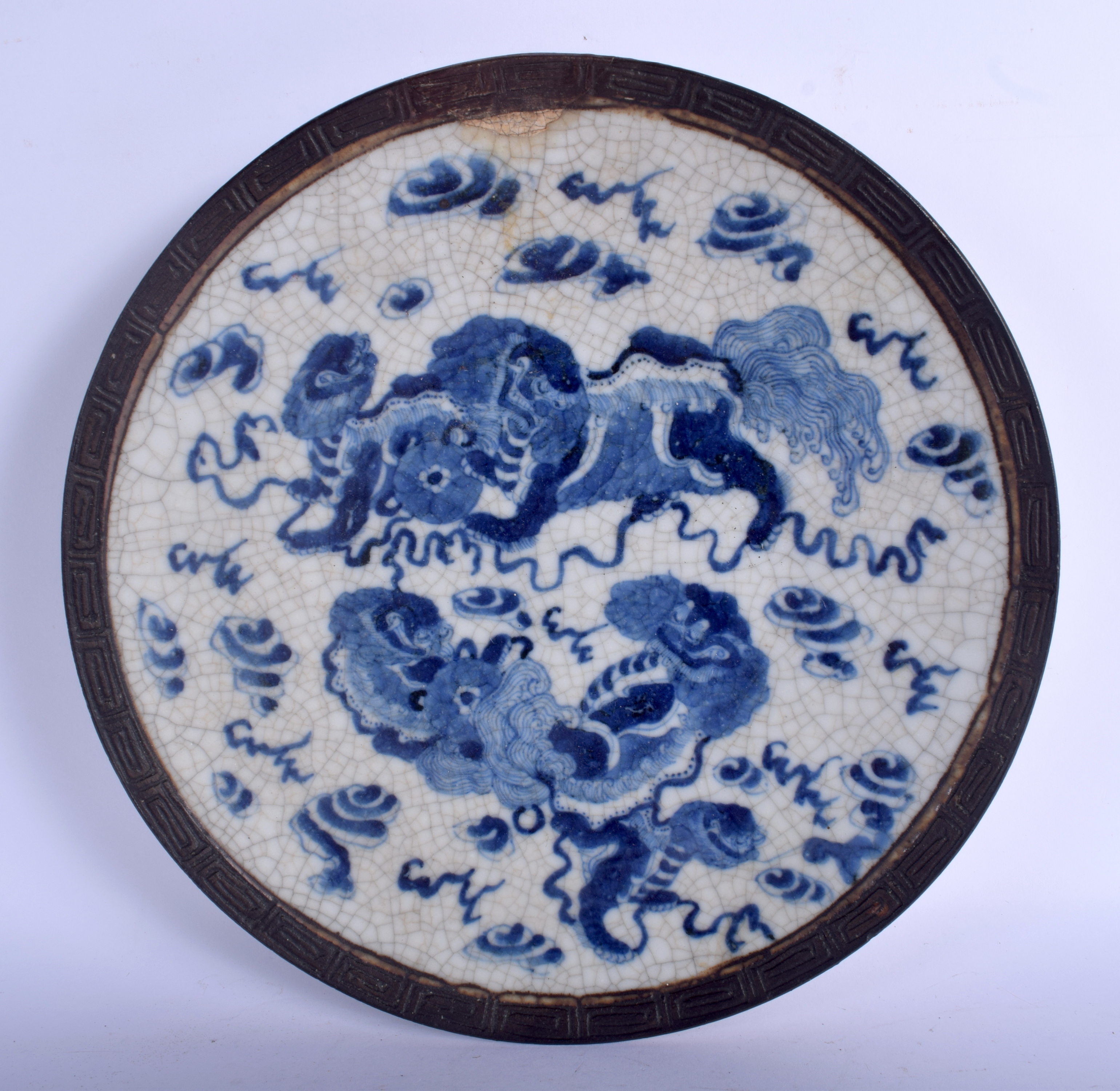 A LARGE 19TH CENTURY CHINESE CRACKLE GLAZED BLUE AND WHITE DISH painted with buddhistic lions. 27 cm